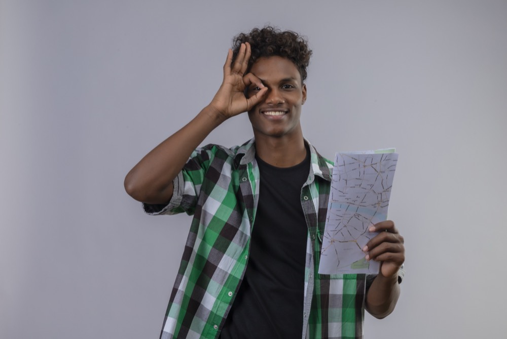 Senior secondary student planning his future studies and overseas options at a laptop