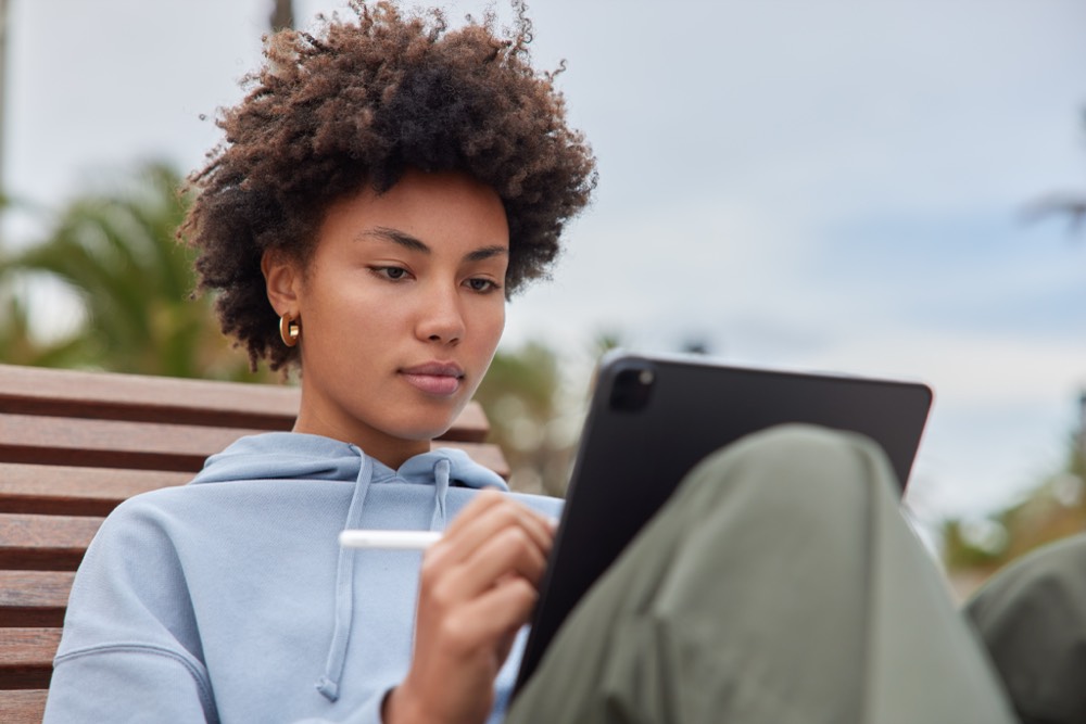 Private exam candidate studying independently with registration documents at home