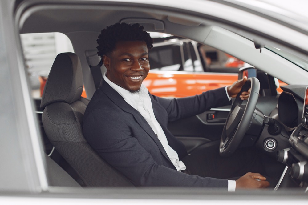 A friendly driver ready to take a student to school